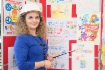 Возле стенда с рисунками работников предприятия «Газпром добыча Уренгой»