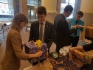 Совет молодых специалистов упаковывает подарки, принесенные работниками предприятия