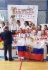 Бронзовую награду в командном кумите получает Алина Анашкина (вторая слева)