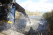 Рыбу выпускали в водоем с помощью специального желоба